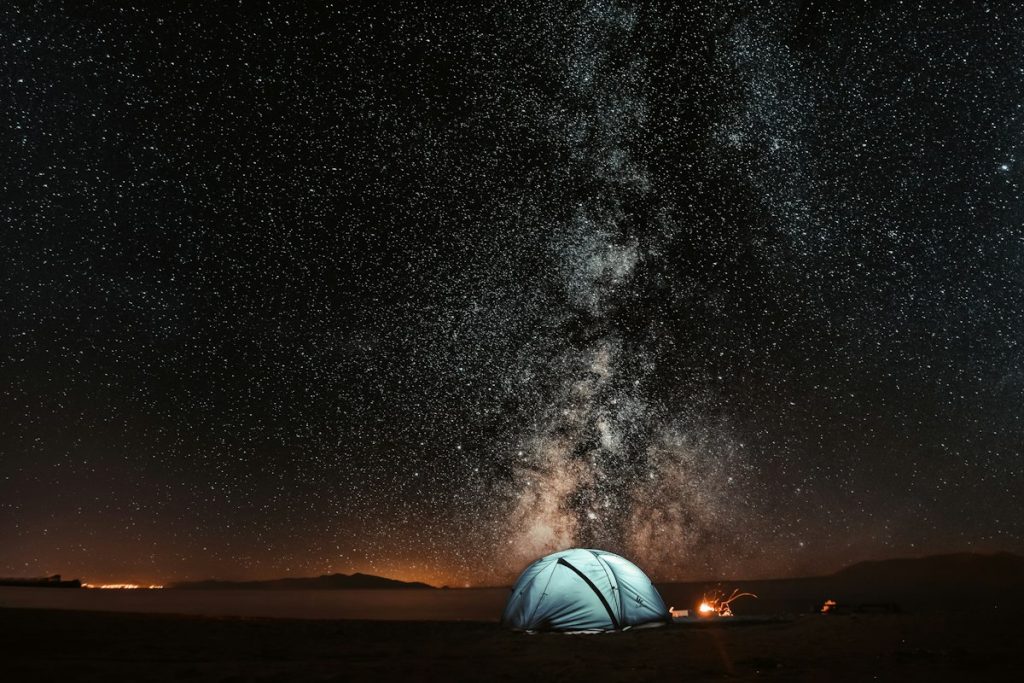 Night sky over a campsite