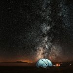 Night sky over a campsite
